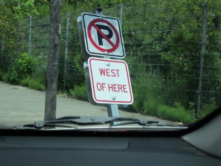 "Parking prohibited West of here".