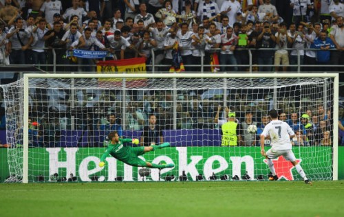 MILAN, ITALY - MAY 28: Cristiano Ronaldo of Real Madrid scores the winning penalty during the UEFA Champions League Final match between Real Madrid and Club Atletico de Madrid at Stadio Giuseppe Meazza on May 28, 2016 in Milan, Italy. (Photo by Shaun Botterill/Getty Images)